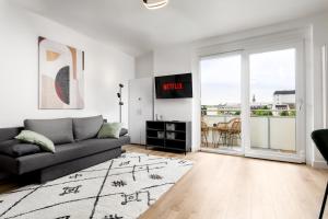 Un lugar para sentarse en Design-Apartment in der Welser Innenstadt mit NETFLIX & Balkon