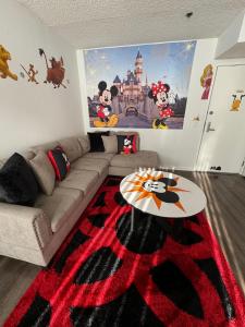 a living room with a couch and a table at Mario, Harry Potter & Disney Loft Universal Studios 10min loft apartment in Los Angeles