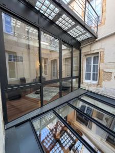 a view of the glass floor of a building at Hotel Le Jacquemart in Dijon