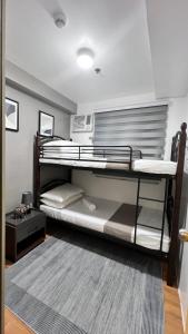 A bed or beds in a room at Urban Charms Seawind Condo, 5 mins to Davao Int'l Airport and Wharf to Samal Beach