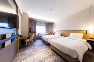 Giường trong phòng chung tại Hotel Metropolitan Edmont Tokyo