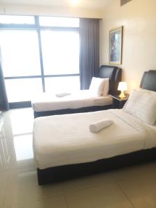 Katil atau katil-katil dalam bilik di 1 Imbi Suites Times Square Bukit Bintang KL