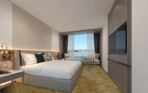 Giường trong phòng chung tại Hotel Grand Chancellor Auckland