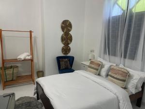 A bed or beds in a room at Nashu House Stone Town