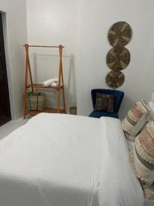 A bed or beds in a room at Nashu House Stone Town