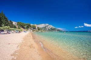 a view of a beach with people in the water at Skyline Suite in Omiš