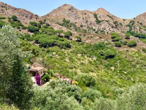 a house on the side of a mountain at Aria di Collina - Isola d'Elba in Porto Azzurro