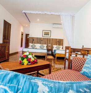 Krevet ili kreveti u jedinici u okviru objekta Travellers Beach Hotel