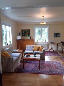 a living room with a couch and a coffee table at Haus Vitsippan in Mariannelund