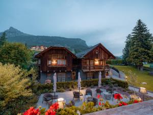 a house with a patio in front of it at Sportony Mountain Lodges in La Villa