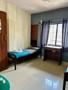 Giường trong phòng chung tại Backpacker Hostel