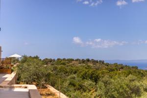 a view of the ocean from the roof of a house at Lakkos Villas in Kardamili