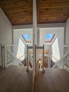 a staircase in a house with wooden ceilings at Leopold Chillout Hostel in Sarajevo