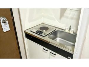 A kitchen or kitchenette at Takatsuki W&M Hotel - Vacation STAY 48538v