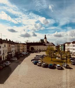 a group of cars parked in a parking lot at Hotel Maxim in Frýdek-Místek