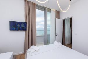 Krevet ili kreveti u jedinici u okviru objekta Sea & Sand Hotel