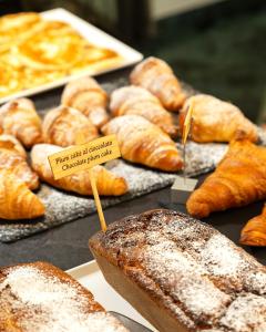 a bunch of different types of breads and pastries at Hotel Ancora in Verbania