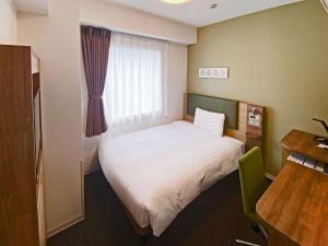 Krevet ili kreveti u jedinici u okviru objekta Comfort Hotel Sapporo Susukino