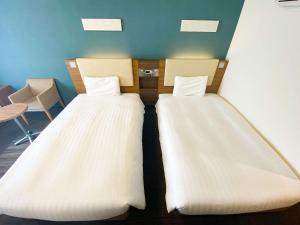 Krevet ili kreveti u jedinici u okviru objekta Comfort Hotel Sapporo Susukino