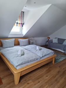 a bedroom with a large bed with two dogs on it at Villa Feyen in Trier in Trier