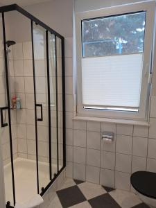 a bathroom with a shower and a window at Villa Feyen in Trier in Trier