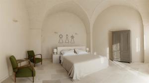 Gulta vai gultas numurā naktsmītnē Masseria Vaccaro by Raro Villas - Self Check-in