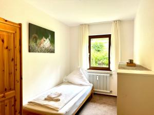 Krevet ili kreveti u jedinici u okviru objekta Ferienwohnung Lotti + Hochschwarzwald Card