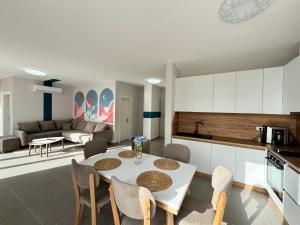 A kitchen or kitchenette at R Apartments