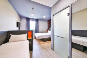 Vuode tai vuoteita majoituspaikassa easyHotel Paris Charles de Gaulle Villepinte