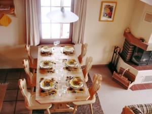 a dining room table with plates of food on it at Cosy Apartment in Bellwald 68 m² Mountain View in Bellwald