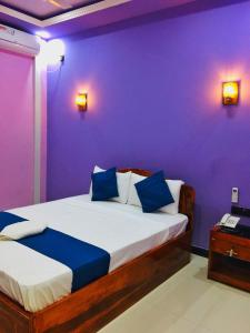 מיטה או מיטות בחדר ב-SP Tourist Hotel Jaffna