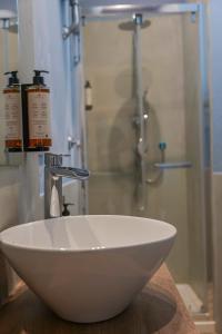 A bathroom at Rooftop Parthenopeo Contemporary Rooms