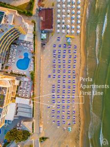 an overhead view of a parking lot next to the beach at Perla Apartments First Line in Nesebar