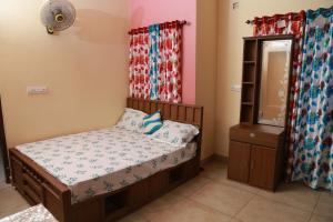 Tempat tidur dalam kamar di CITADEL HOLIDAY HOME