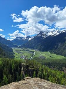 a view of a valley with snow capped mountains at Birkenheim Widmann in Längenfeld