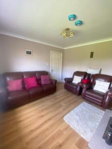 Кът за сядане в 3 Bedroom Bungalow in Kiltimagh