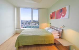 A bed or beds in a room at Revalia Fahle Airport Bus-Station Apartments with Best views