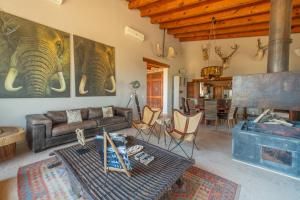 a living room with a couch and a table at Vistas Tapalpa in Tapalpa