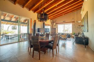 a dining room with a table and chairs at Vistas Tapalpa in Tapalpa