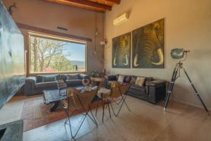 a living room with a couch and a table at Vistas Tapalpa in Tapalpa