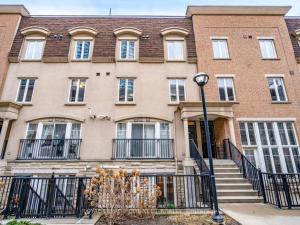 a large brick building with a street light in front of it at Liberty Village Townhouse in Toronto