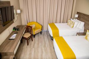 Two Rivers Hotel में एक कमरे में एक या कई बेड