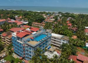 an aerial view of a building with the ocean in the background at De Mandarin Goa in Candolim