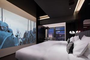 Tempat tidur dalam kamar di ISEYA Design Hotel - Chengdu Taikoo Li