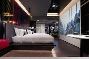 Tempat tidur dalam kamar di ISEYA Design Hotel - Chengdu Taikoo Li