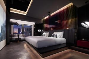 Tempat tidur dalam kamar di ISEYA Design Hotel - Chengdu Taikoo Li