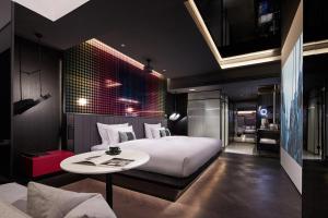 Tempat tidur dalam kamar di ISEYA Design Hotel - Chengdu Taikoo Li