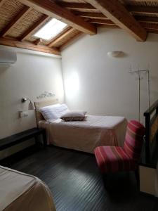 A bed or beds in a room at Aquae Sinis Albergo Diffuso