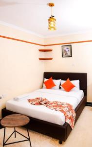 A bed or beds in a room at Shalom Apartments Naivasha