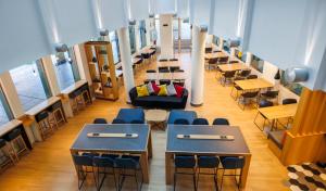 a classroom with desks and chairs and tables at Hotel Logroño in Logroño